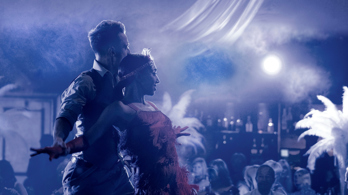Two dancers embrace within smoke during private event in Edinburgh function room The Stables, in the grounds of Prestonfield House Hotel