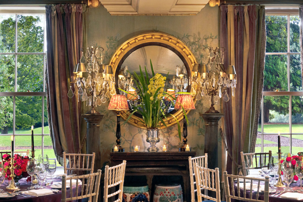 Windows and mirror with ornate decoration in Garden House private dining room in Edinburgh at Prestonfield House Hotel